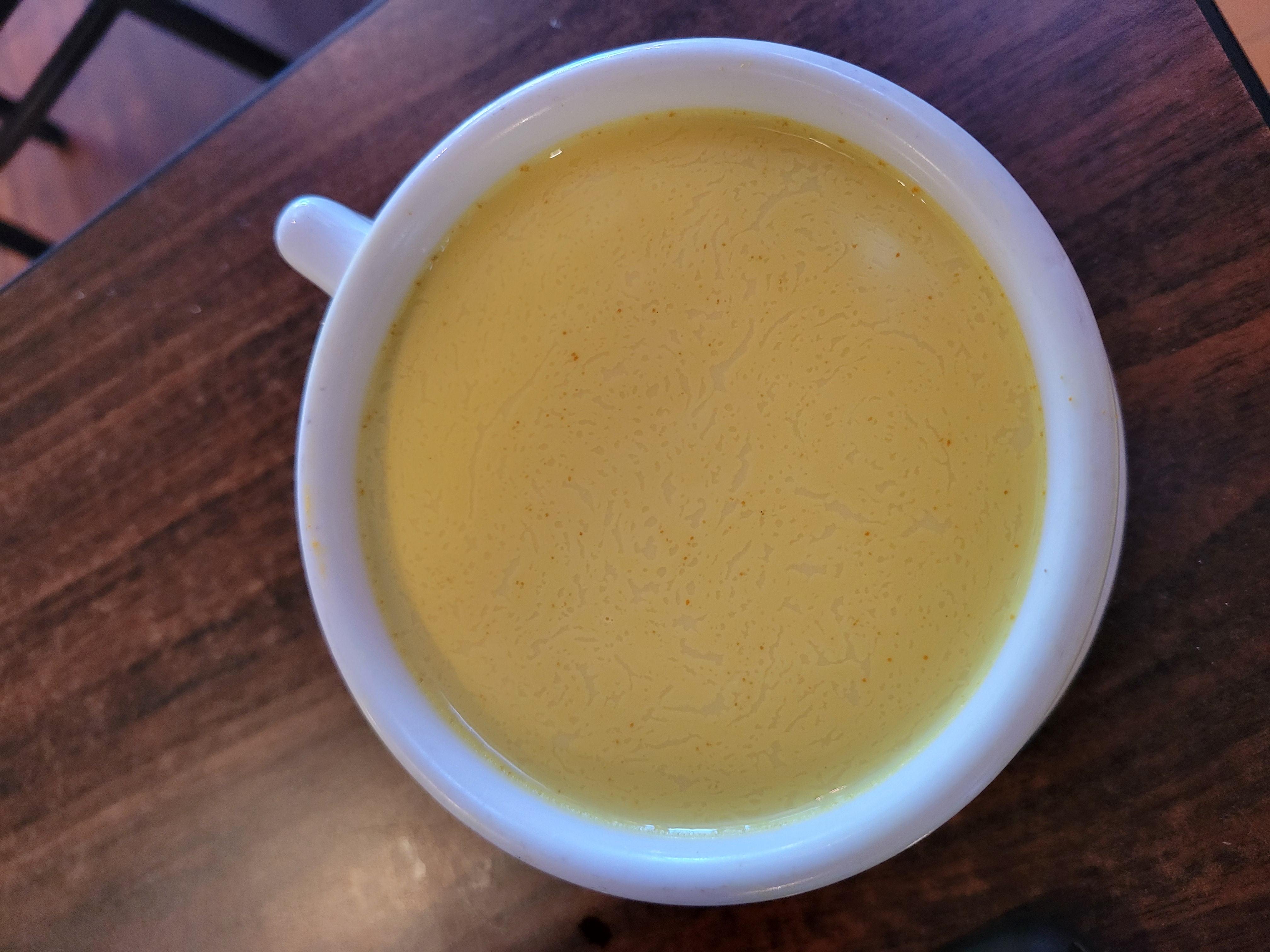 Glass cup of golden milk.